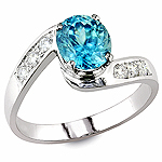 Blue zircon and white diamond gold ring.