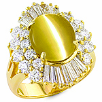 Chrysoberyl cats eye white diamond and yellow gold ring.