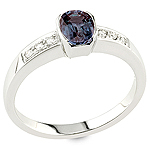 Color change garnet and white diamond gold ring.
