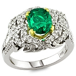 Green emerald and white diamond gold ring.