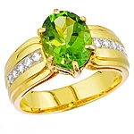 Green peridot and white diamond gold ring.