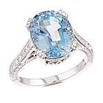 Blue aquamarine and white diamond gold ring.