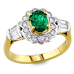 Green emerald and white diamond gold ring.