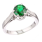 Green tsavorite and white diamond gold ring.